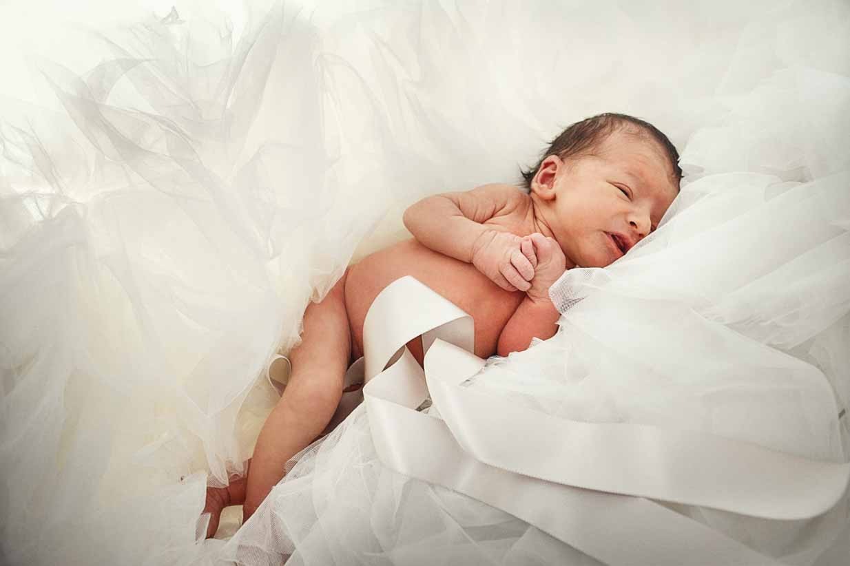 Baby on wedding dress | Calgary Newborn Photographer | SLIVER Photography